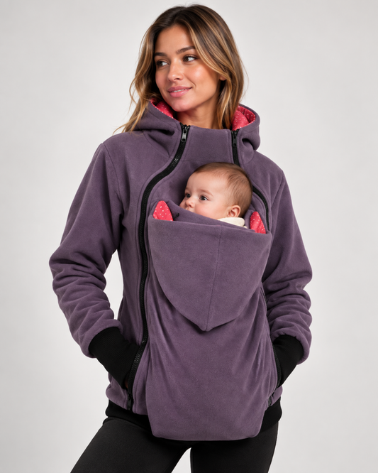 Purple kangaroo babywearing fleece hoodie with pink polka-dot lining, mother carrying baby in built-in front pouch