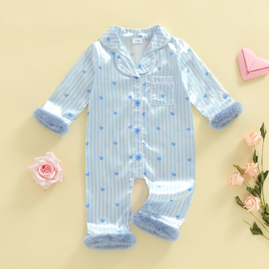 Baby wearing the heart print jumpsuit with plush details