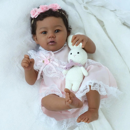Close up of baby doll face and lace outfit