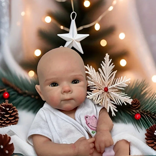 Mini silicone reborn baby doll among Christmas decorations