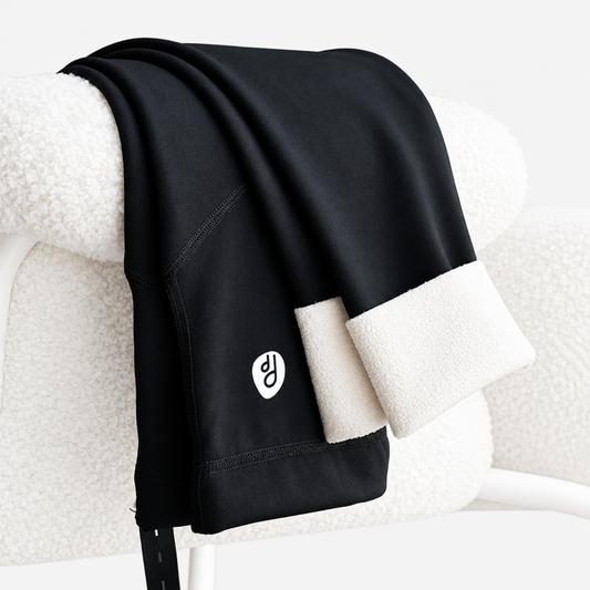Thick fleece maternity leggings in black with built-in belly support panel, front view on clean studio background
