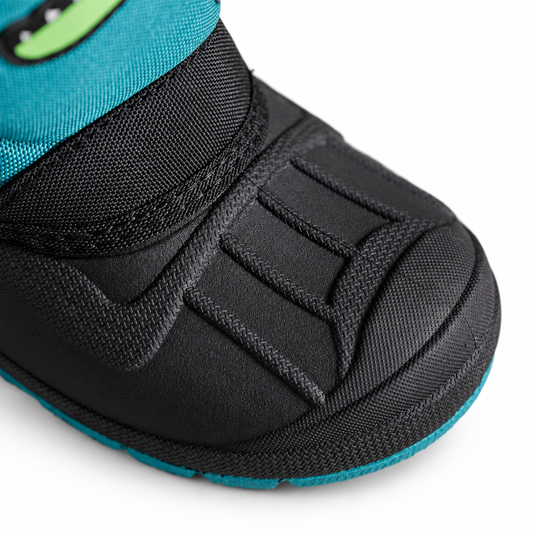 Dinosaur print snow boot sole and tread detail, studio shot