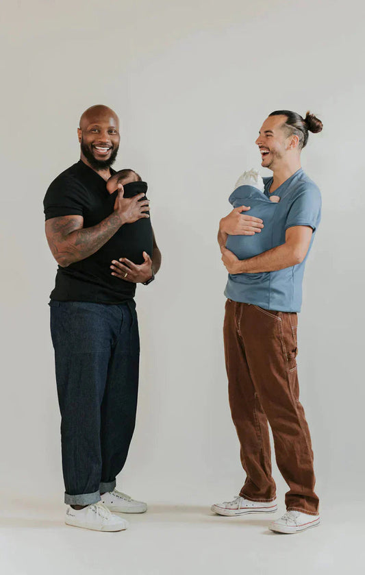 Baby carrier t-shirt worn with baby in the front skin-to-skin pocket