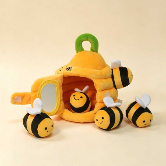 Plush yellow beehive toy with three sensory bees peeking out of the front opening