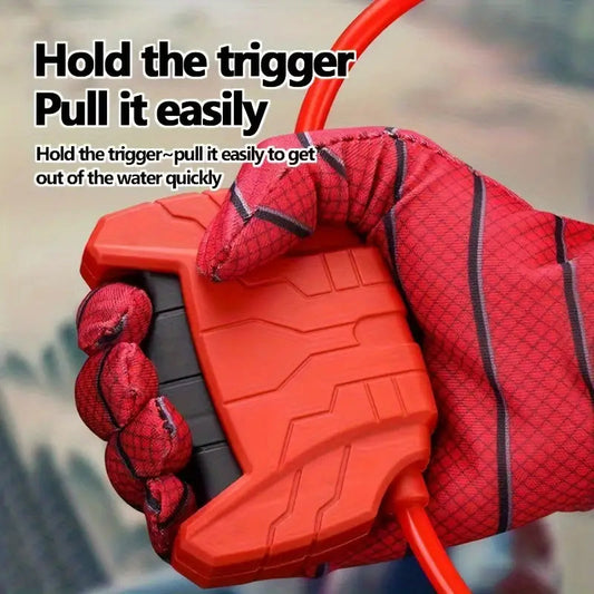 Close-up of the wrist-mounted trigger mechanism on the red water blaster glove