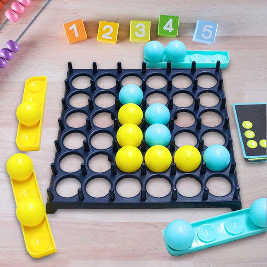 JumpiBalls game board with numbered blocks, coloured balls and challenge cards laid out