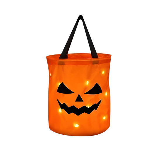 Halloween candy pumpkin bucket with LED lights, side view