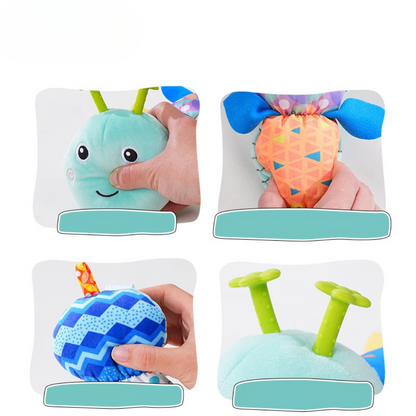 Baby playing with caterpillar sensory toy