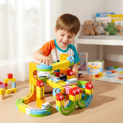 Boy playing with magnetic rail train set