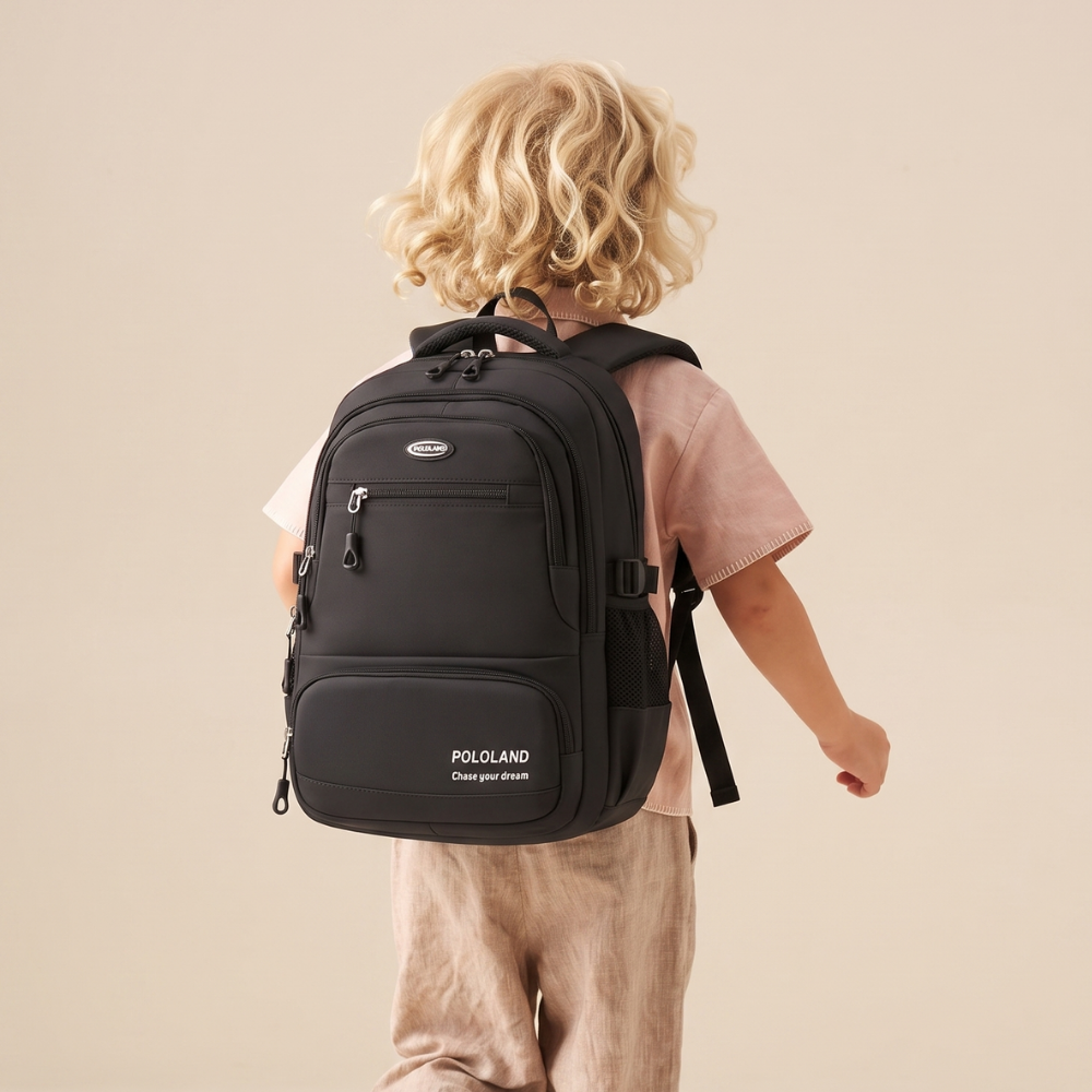 Black backpack worn on shoulders