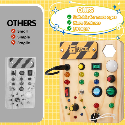Toddler pressing light-up switches on the sensory busy board