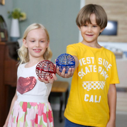 Kids holding Magic Flying Boomerang Ball in red and blue