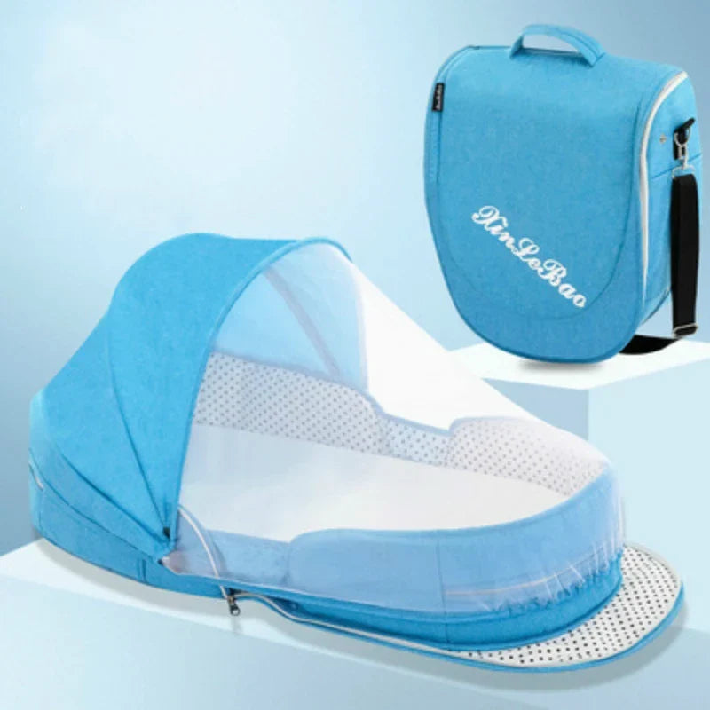 Baby travel bed with mosquito net set up indoors
