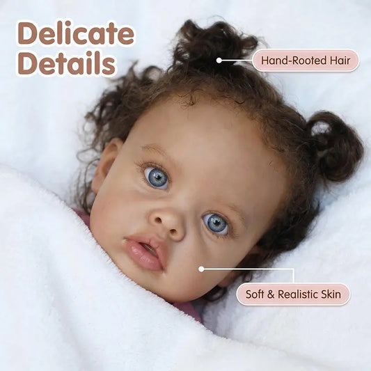 Close up of reborn toddler doll face showing hand rooted curly hair and blue eyes