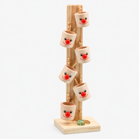 Angled view of the wooden marble run tree tower showing the branch pegs and marble path