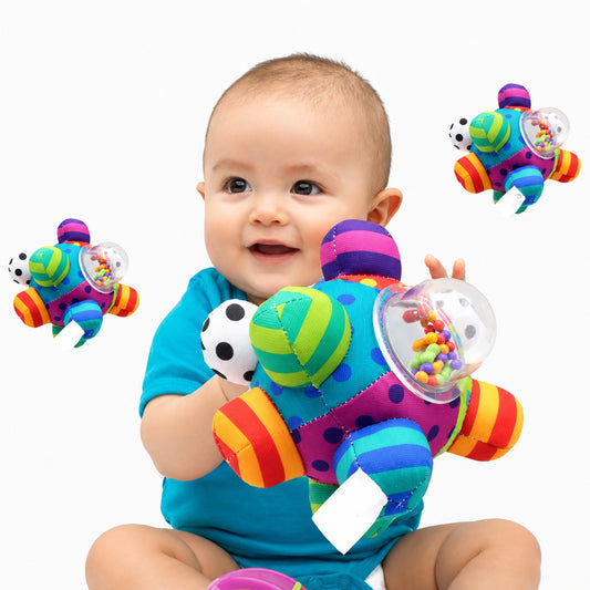 Baby holding the colourful bumpy textured sensory bell ball rattle, with two close-up insets showing the bead-filled bell windows and striped fabric panels