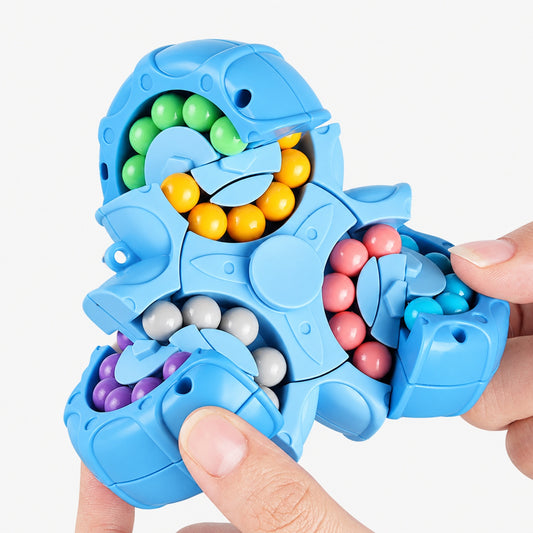 Close-up of blue bead maze fidget cube opened to show green, yellow, pink, grey, and purple beads inside each panel
