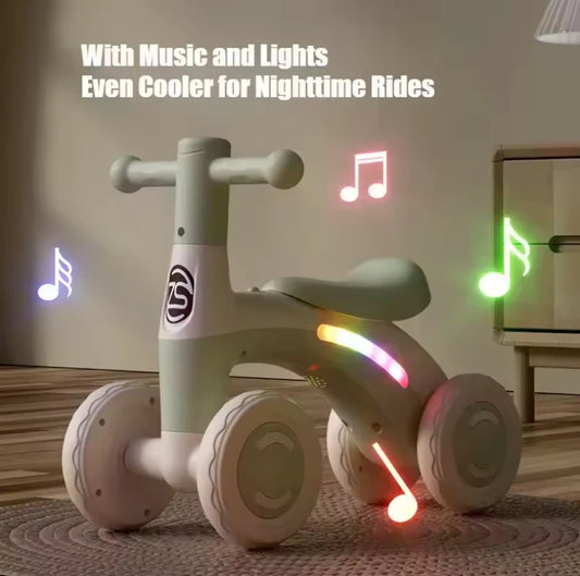 Baby Balance Bike with LED lights and music — nighttime hero shot