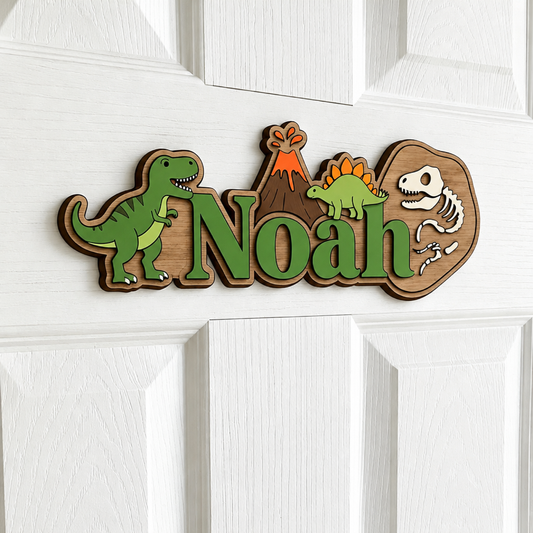 Close-up of 3D wooden dinosaur name sign with green lettering showing layered detail
