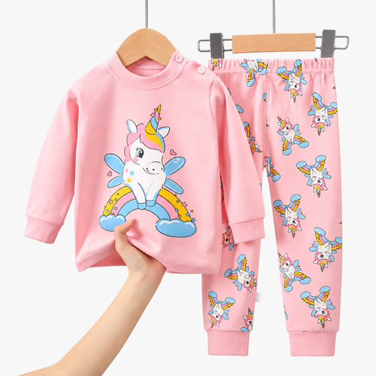 Pink unicorn print long-sleeve pyjama top and trousers, flat lay studio photo