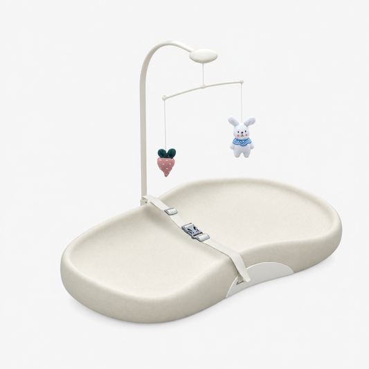 Padded baby changing mat shown in full, flat view highlighting the thick cushioned surface and wipe-clean fabric