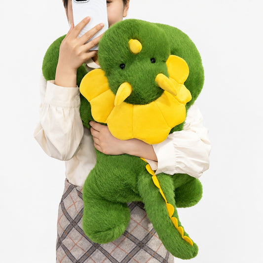 Green long-arm plush dinosaur pillow with extra-long huggable arms, studio product photo on white background