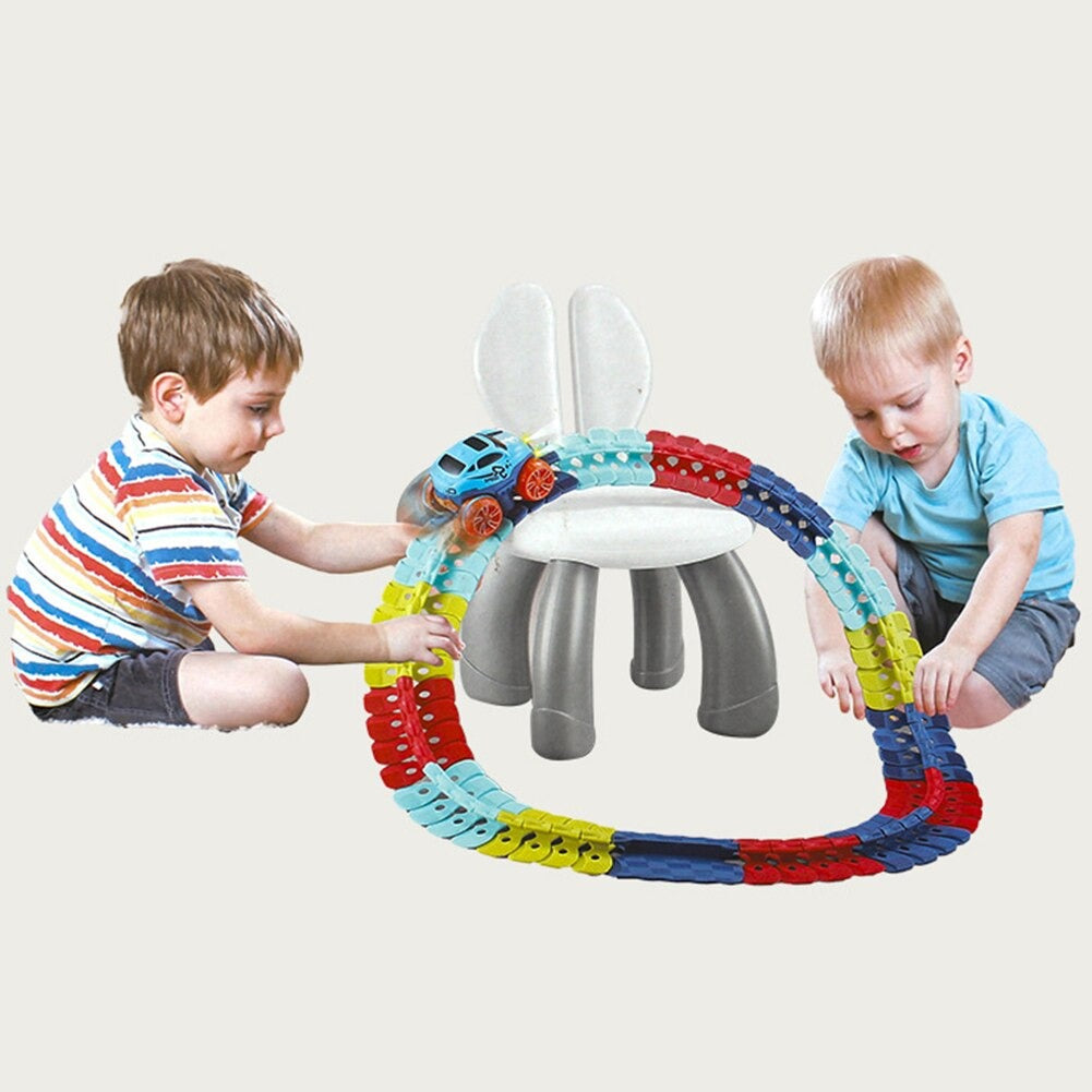 Children playing with flexible race track set