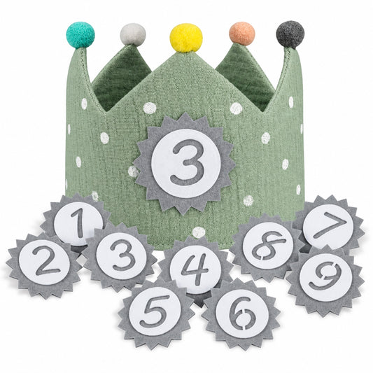 Sage green muslin birthday crown with white polka dots and number 3 badge, felt number patches 1-9 in front