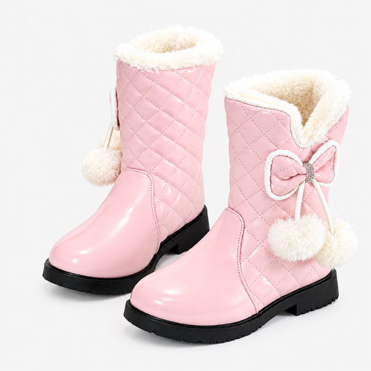 Pink quilted girls' snow boots with faux fur cuff, bow and pom-poms, studio product shot on white background