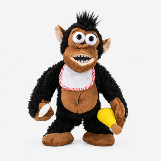 Magnetic feeding gorilla plush toy on a clean white studio background, showing full black and brown fur detail