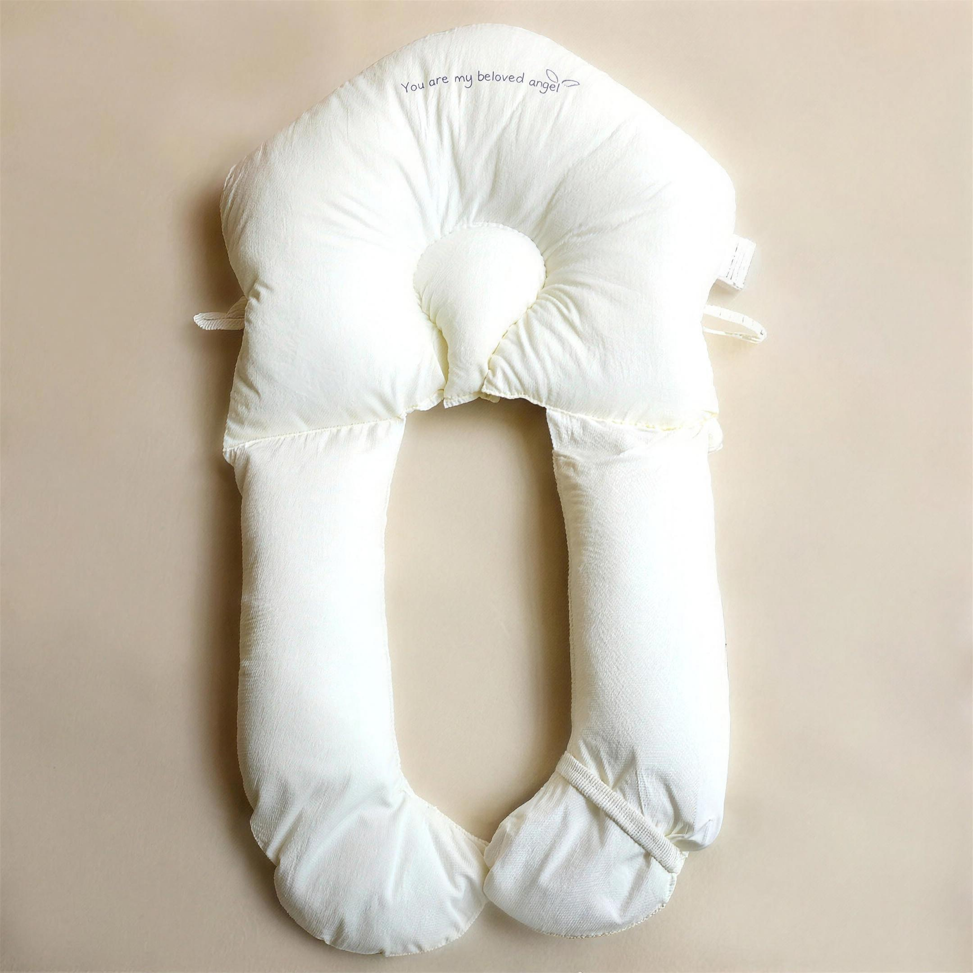 Baby support pillow in nursery
