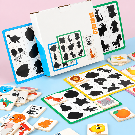 Close-up of wooden animal shape tiles for shadow matching game