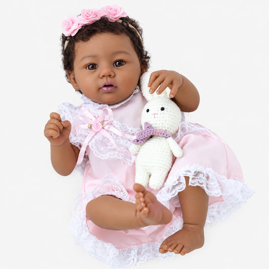 Close up of baby doll face and lace outfit