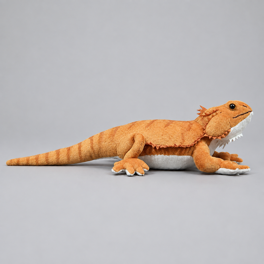 Realistic bearded dragon lizard plush toy shown from a side profile angle, highlighting its textured spikes and tail