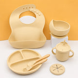 7-Piece Silicone Baby Feeding Set — Bib, Divided Plate, Suction Bowl, Sippy Cup & Wooden Utensils thumbnail 4