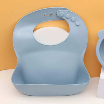 Silicone baby bib with food catcher pocket