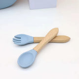 7-Piece Silicone Baby Feeding Set — Bib, Divided Plate, Suction Bowl, Sippy Cup & Wooden Utensils thumbnail 6