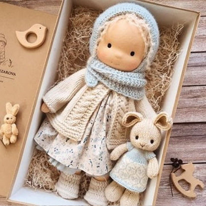Handmade fabric doll with blue hat