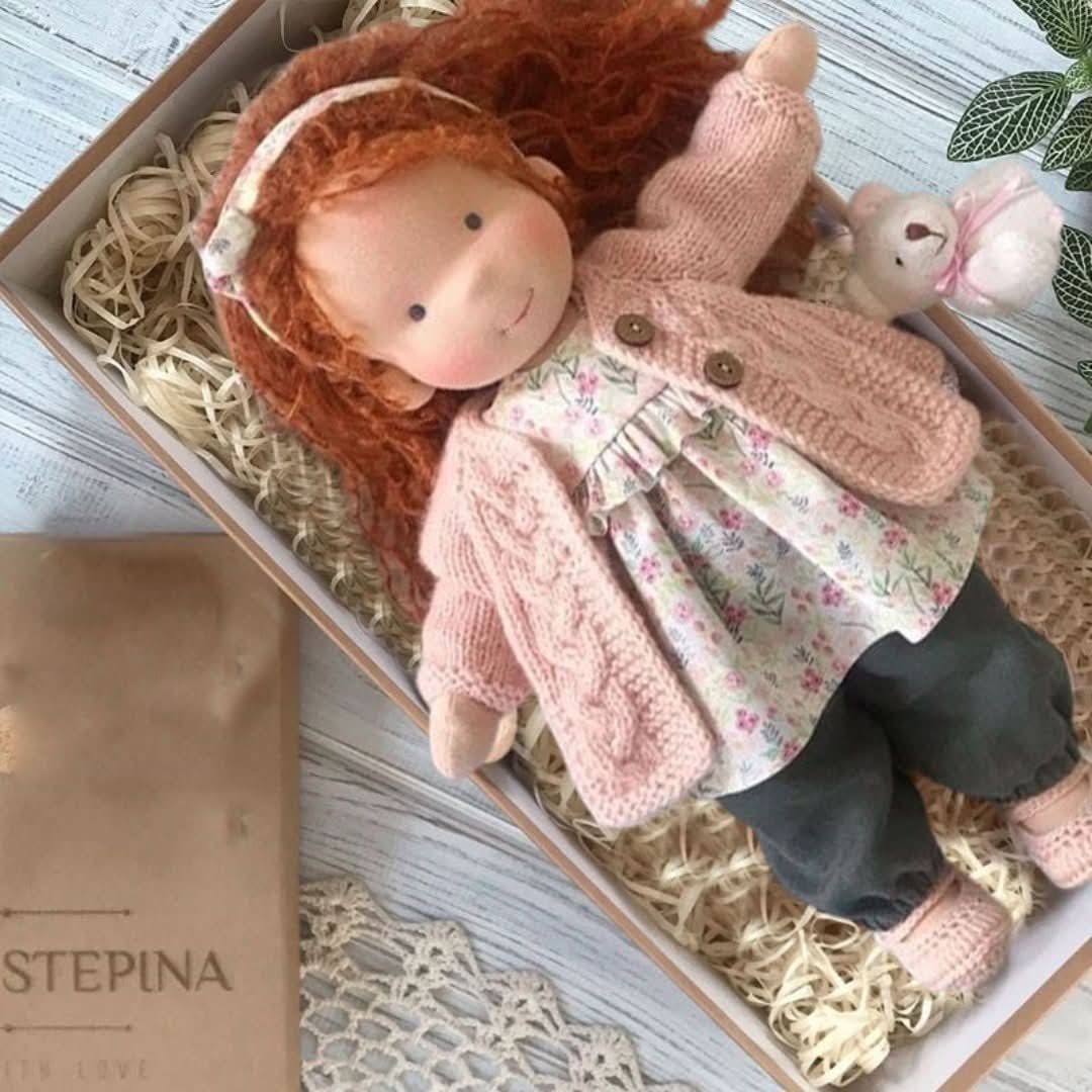 Handmade fabric doll with red hair