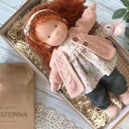 Handmade fabric doll with red hair