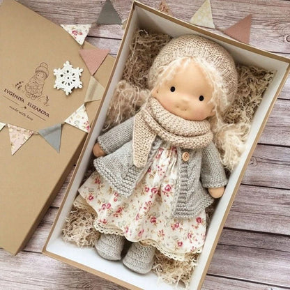 Handmade fabric doll with beige hat