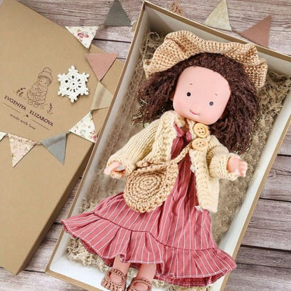 Handmade fabric doll in red dress